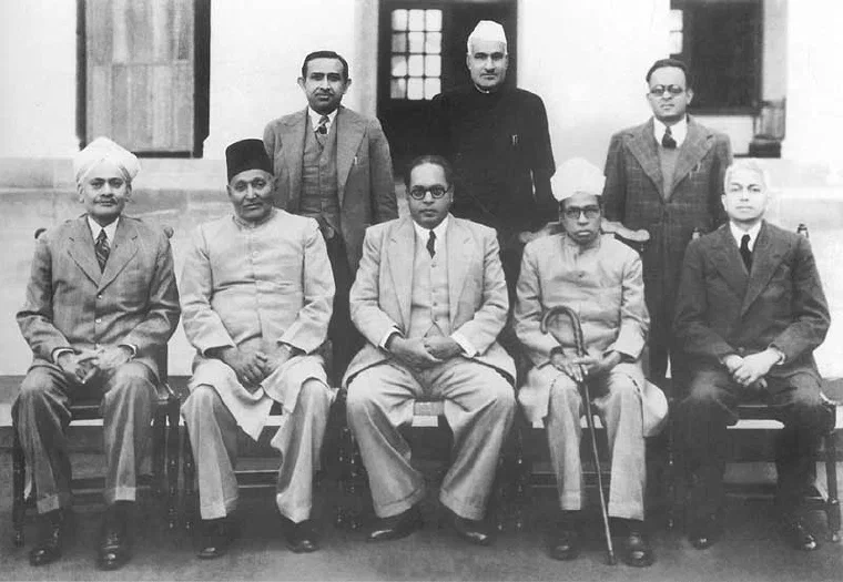 Group photograph from August 1947 of B. R. Ambedkar seated with the other members of the Constitution drafting committee