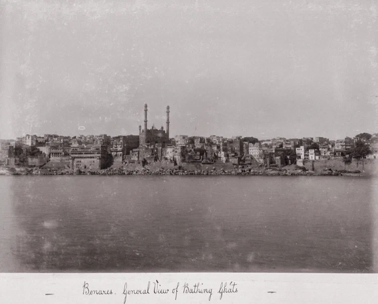 Samuel Bourne photograph from the late 1860s of the bathing ghats at Benares, with stone steps crowded down to the Ganges